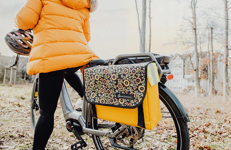 Sarinee messenger bag attached to bike as a pannier