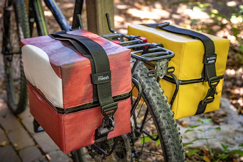 Close-up of the pannier for recors installed on a bike - buckles by FIDLOCK in focus