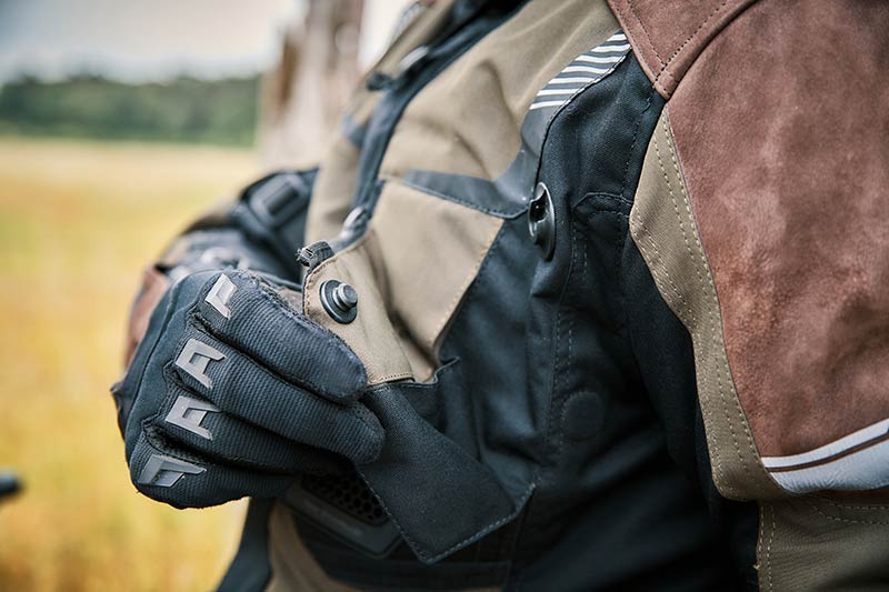 close-up of SNAP fasteners used on the ventilation flaps of a motorbike jacket