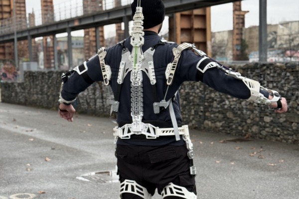 man wearing exoskeleton with FIDLOCK buckles