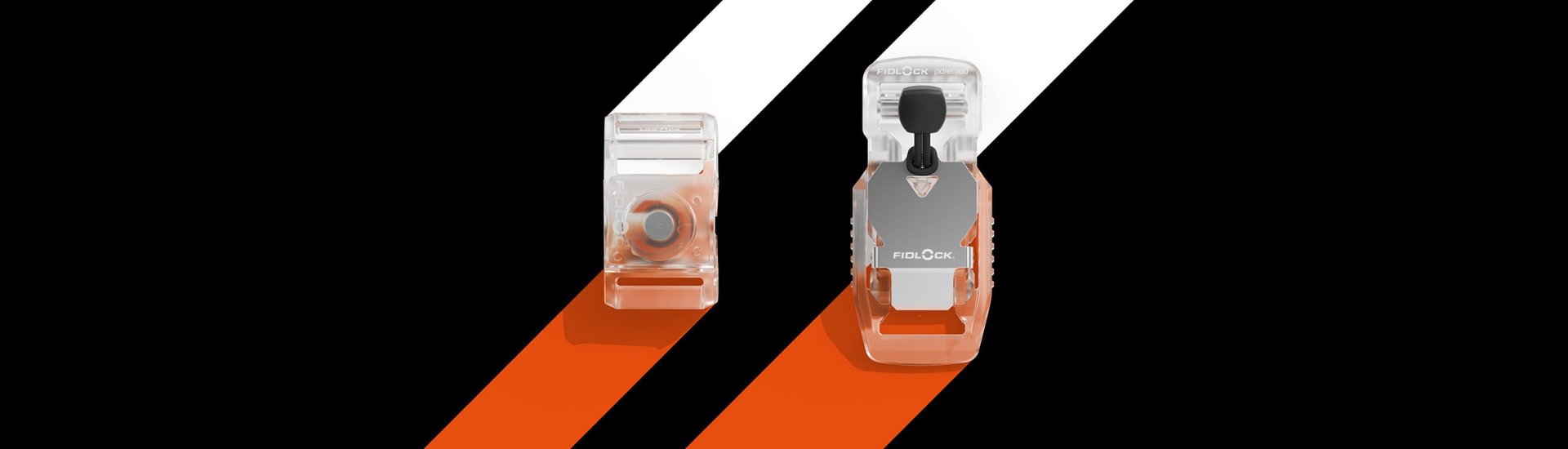 Two transparent FIDLOCK buckles on plain background