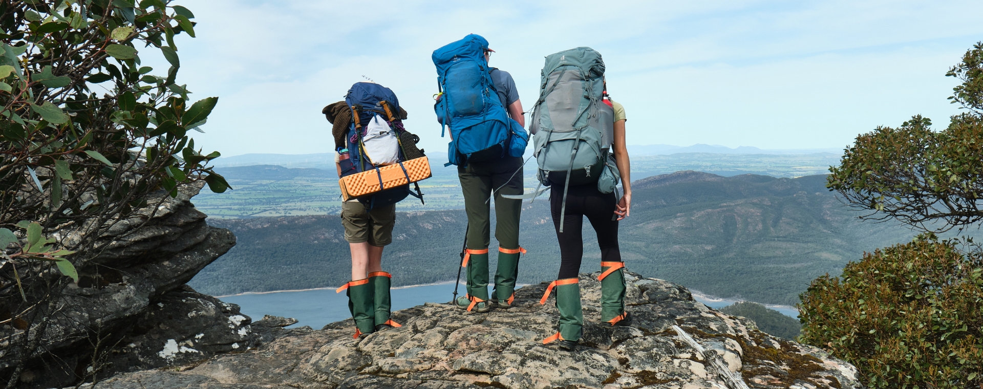 three people walking outdoors