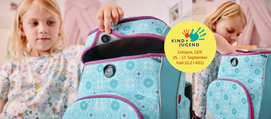 Girl opening school bag with COINTRAP fastener 