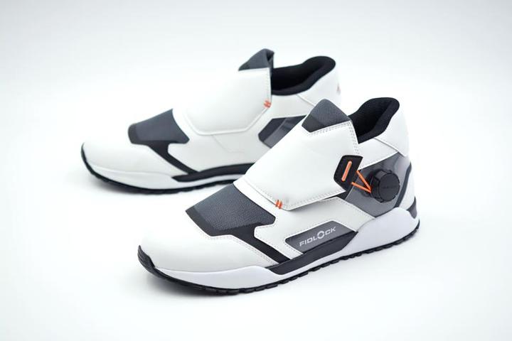 a par of the FIDLOCK concept sneaker shown from a front perspective view