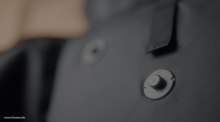 Close-up shot of the SNAP fasteners on the LiWAVE backpack