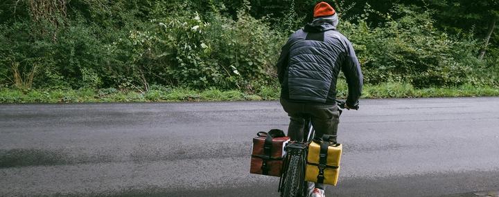 DJ Oonops cycling away with his pannier for records
