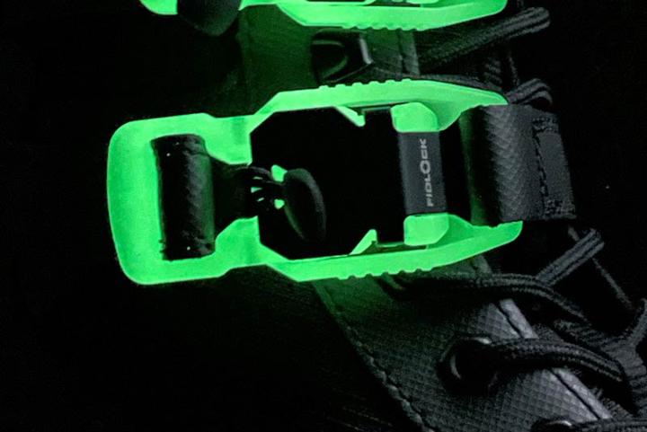 close-up of a glow-in-the-dark V-BUCKLE on a boot