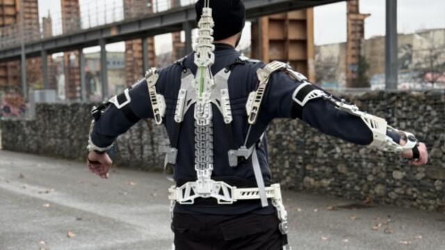 Man from behind wearing exoskeleton 