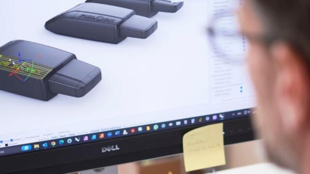 fidlock design dna - men working on a screen